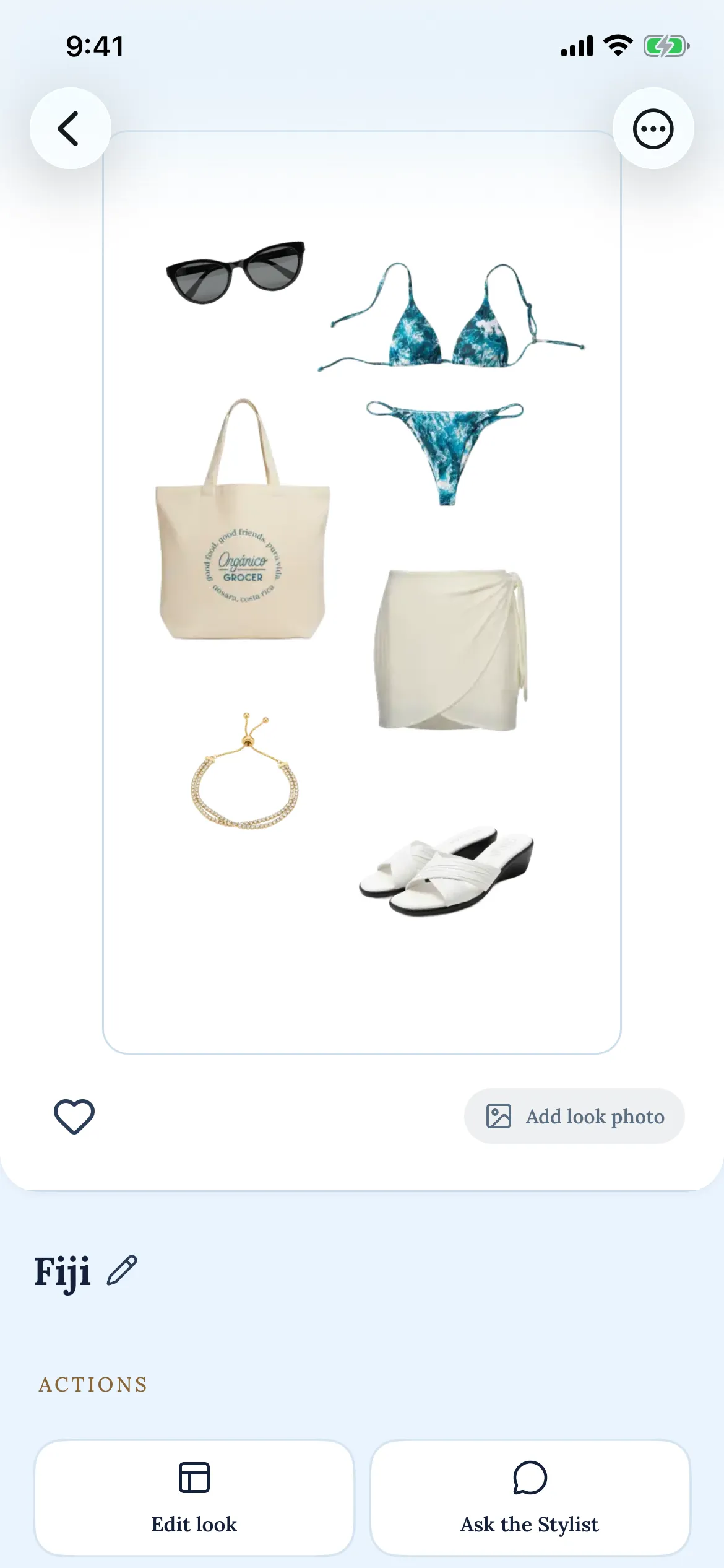 A saved look in Layers named Fiji: sunglasses, a printed bikini, a canvas tote, a cream wrap skirt, a gold bracelet and white sandals laid out together.